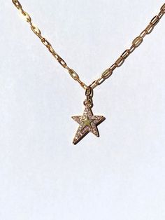 Y2K Magic Star Necklace → y2k gold star charm with a sparkling border of crystals → Charm measures 16 mm x 13 mm, brass based 18k gold plated charm → Stainless steel cable chain, highly resistant against tarnishing → Choose your own chain length, each one comes with a 5 cm extension chain so it is adjustable All of our pieces are tested for months in different solutions before being incorporated into jewelry designs. Quality is super important to us, so all of our pieces are made to last for yea Luxury Star Charm Necklace, Gold Star-shaped Sparkling Jewelry, Gold Sparkling Star Jewelry, Sparkling Gold Star-shaped Jewelry, Wishing Star, Lucky Necklace, Y2k Necklace, Star Necklace Gold, Celestial Necklace