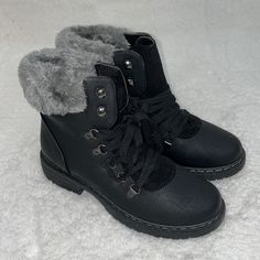 Black Boot, Grey Faux Fur Trim. Never Worn, Perfect Condition. Winter Combat Boots In Faux Leather Medium Width, Winter Combat Boots In Medium Width Faux Leather, Black Lace-up Boots Medium Width For Winter, Black Synthetic Ankle Combat Boots, Winter Combat Boots With Flat Heel And Synthetic Material, Winter Synthetic Combat Boots With Flat Heel, Winter Combat Boots With Flat Heel, Black Lace-up Boots With Flat Heel, Black Boots With Faux Fur Lining And Round Toe