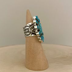 Sterling silver cluster ring set with China mountain turquoise. This ring features beautiful stones and an amazing stamping design on the shank. Handmade by Navajo silversmith, Darrell Cadman. Ring size: 6.5 Measurements: 1.5" x 1.25" Center stone: 0.63" x 0.5" Other stone: 0.31" x 0.19" Band width: 0.59" Weight: 0.76oz (21.5g) Materials: sterling silver(silver925), China mountain turquoise *About Darrell Cadman* Darrell Cadman was born 1969 in Gallup, New Mexico and began making jewelry in 1992 Western Style Stamped Turquoise Ring Gift, Artisan Stamped Turquoise Ring, Unique Stamped Turquoise Ring, Southwestern Stamped Turquoise Ring Gift, Southwestern Style Stamped Turquoise Ring As Gift, Gallup New Mexico, Cluster Ring Set, Beautiful Stones, Kingman Turquoise