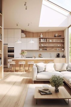 a living room filled with furniture and a skylight over the kitchen area in an open floor plan