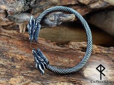 "Viking Arm Ring, Dragon Head Men's Bracelet, Nidhogg Dragon Torc, Stainless Steel Celtic Dragon Torque Cuff, Norse Mythology, Viking Jewelry This solid Nidhogg Dragon Bracelet is made from high quality hypoallergenic stainless steel, suitable for both men and women. It is adjustable and will fit wrist from approx. 16cm up to 20cm (6.3\" - 7.9\")  ➤ Fits to wrist from approx. 16cm up to 20cm (6.3\" - 7.9\")  ➤ Bracelet Length (head to head): approx. 22 cm (8.7\")  ➤ Diameter: approx. 7.5 x 6.5cm (adjustable) ➤ Inner diameter: about 6 x 5 cm (adjustable) ➤ Thickness : about 6mm ➤ Weight : approx. 30-35g.  High quality stainless steel has high resistance to rust, corrosion and tarnishing, which requires minimal maintenance. Stainless steel is one of the most bio-compatible metals, so stainle Nidhogg Dragon, Viking Arm Rings, Arm Ring, Celtic Dragon, Dragon Bracelet, Dragon Head, Men's Bracelet, Viking Jewelry, Norse Mythology