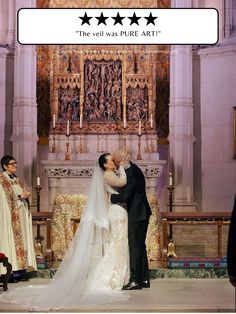 a bride and groom kissing in front of the alter