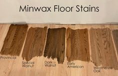 several different types of wood stain on the floor in front of a sign that says minwax floor stains