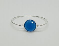 "Beautiful large blue chalcedony sterling silver bangle bracelet.  Hard to capture the beauty of the stone.  Great bracelet to wear everyday! Bangle Bracelet ~ Sterling Silver Bezel Sterling Silver Chalcedony Stone ~ 1\" From Ring to Ring An adorable cotton drawstring bag, a pink polishing cloth and an anti-tarnish square is included.  Ready for gift giving! 🛍Follow Me On Instagram:       Belllaluccecreations" Chalcedony Bracelet, Sweet Ring, Chalcedony Stone, Silver Bangle Bracelet, Sterling Silver Bangle Bracelets, Sterling Silver Bangle, Silver Bangle Bracelets, Sterling Silver Bangles, Silver Bangle