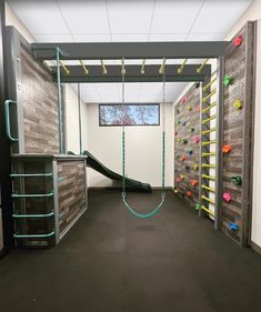 an indoor climbing wall in the shape of a slide