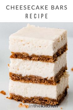 three layered cheesecake bars stacked on top of each other with the text overlay