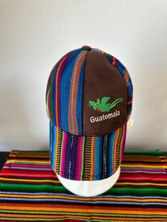 Embroidered Guatemala hat with El Quetzal, is handmade in Antigua Guatemala. Patterns and colors may vary depending on the textile. Unisex     Caring Instructions: - Wash with cold water only - Air Dry Guatemalan Scarf, Adjustable Hat, Guatemala, Air Dry, Cold Water, Accessory Gift, Pet Supplies, Display Homes, Textiles