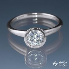 Round Diamond Full Bezel Set Solitaire Engagement Ring - SI2/G (1.0CT) - Stellar Fields Canadian Arctic, Contour Wedding Band, Bezel Set Engagement Ring, Bezel Engagement Ring, Modern Engagement Rings, Diamond Engagement Wedding Ring, Engagement Rings Bridal Sets, Ring Wedding Band, Forever One Moissanite