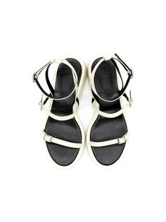 Editor's NoteBuckle strap platform sandals will complete your summer outfit- Simple strappy sandals- Designed with chic almond toe- Adjustable ankle strap to find the most comfortable fit- Contrast color insole- Perfect for summerMeasurement (inch)- KR220(US 5)-KR255(US 8.5)- Height 1.4in.* Fits true to the size* Please refer to the size chartComposition & Care- Cow Skin (Cream) + Lamb Skin (Black)* Deformation or discoloration might happen if in contact with humid air or high temperature* A Summer Sport Sandals With Heel And Toe Straps, Modern Ankle Strap Sandals For The Beach, Summer Sport Sandals With Heel And Ankle Strap, Modern White Strappy Sandals, Modern Open Heel Sport Sandals For Summer, Modern Double Strap Sport Sandals For Summer, Modern Ankle Strap Sport Sandals For Summer, Modern Ankle Strap Sport Sandals For Spring, Modern Sport Sandals With Ankle Strap For Spring