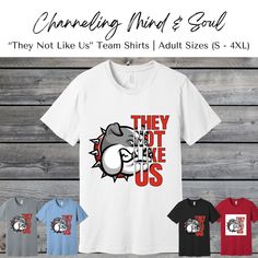 Celebrate your sports team with these Mascot "They Not Like Us" T-shirts. You will receive a printed T-shirt based on the size and shirt color selected in the dropdowns.  Printed on Bella Canvas tees. These shirts are made of 100% Airlume combed and ring-spun cotton, offering superior softness and comfort.  Please message us for custom designs. We are happy to create something unique for you. Casual White Shirt With Team Logo, White Team Spirit Shirt With Logo, White Shirt With Team Logo For Team Spirit, White Shirt With Team Logo, White Logo Print T-shirt For Team Events, Baseball Season T-shirt With Team Logo For Team Events, Baseball Season Team Logo T-shirt For Team Events, White T-shirt For Baseball Season Team Events, White T-shirt For Baseball Team Events