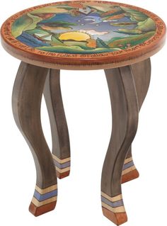 a wooden table with an artistic design on it