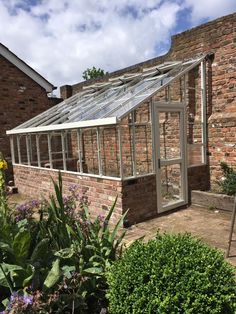 an old brick building with a glass roof