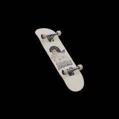 a skateboard is flying through the air on a black background