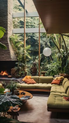 a living room filled with furniture and lots of plants