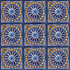 a blue and yellow tile pattern with an orange flower in the center, on a white background