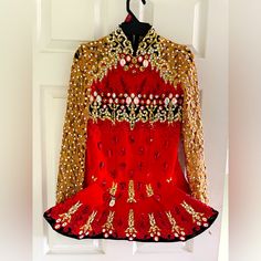 Red, Gold, And Black Elevation. Would Suit U8-U13. Was Worn By A World Qualifier And Really Shines On Stage! My Own Dancer Made It To Preliminary Champ Wearing This Dress. The Measurements Are Lying Flat, It Has Been Let Out Completely, So Best To Buy If You Are Wanting To Take In. Comes With 2 Different Head Pieces. The Crown Has Been Completely Re-Gemmed For Ultimate Glitz Irish Dance Dress, Head Pieces, Irish Dance, Dance Dress, Dance Dresses, On Stage, The Crown, Kids' Dresses, Red Gold