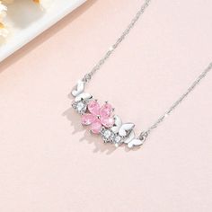 Indulge in the beauty of spring with our 925 Silver Pink Cherry Blossom Butterfly Necklace. Crafted with the finest materials, this delicate piece features a charming butterfly and blooming cherry blossom design. Elevate any outfit and add a touch of elegance to your look. Tarnish proof Water proof Sleep / Nap proof Safe for sensitive skin Wear it while working out &showering Designed to wear 24/7 If there is no stock, the product will take 60 days to produce Please leave your usual email address and phone number for order contact There is a discount code on the store homepage, limited to one time per person, welcome to use Details Materials: 925 Sterling Silver Stone: CZ Diamond Weight: 2.5G Length：40+5CM SKU：AN24071906 Cherry Blossom Butterfly, Cherry Blossom Design, Sun And Moon Rings, Pink Cherry Blossom, Flat Back Earrings, Pink Cherry, Blossom Design, Feather Necklaces, Gold Bracelet Chain