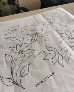 a piece of paper with flowers drawn on it