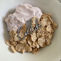 a white plate topped with cereal covered in whipped cream and the word collide written over it