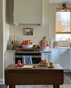 the kitchen is clean and ready to be used for breakfast or dinnertime with fresh fruit on the counter