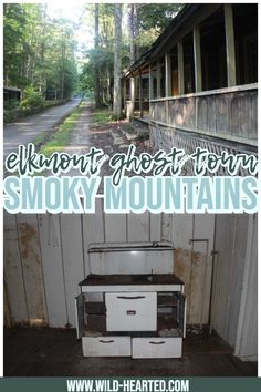 an old stove sitting in the middle of a wooden floor next to a white building