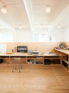 an empty room with wooden shelves and desks