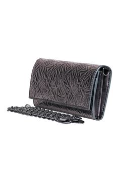 Go big and bold with this metallic crossbody from Kenzo. This sleek and chic bag features a detachable gunmetal strap to carry in hand as a wallet, or as a going out bag! Pair this with a moto jacket and a little black dress for a timeless look. Kenzo embossed logo font Front flap closure Wallet style interior pockets Detachable gunmetal chain strap Back zipper pocket Includes dust bag Silver Wallet On Chain For Evening, Silver Rectangular Wallet On Chain For Evening, Silver Evening Wallet On Chain, Silver Leather Wallet On Chain For Evening, Evening Wallet On Chain With Silver-tone Hardware, Going Out Bag, French Girl Chic, Logo Font, A Little Black Dress