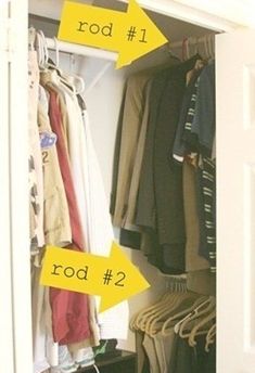 an open closet with clothes hanging on hooks and two yellow arrows pointing to the right