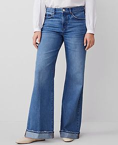 Elevate your weekend wardrobe with the Ann Taylor Weekend Palazzo Jeans, where comfort meets chic effortlessly. These wide-leg jeans are a modern staple with a flattering high waist and a relaxed fit that promises ease all day long.

- Size: 14 Regular
- Color: Bright Stone Wash
- Material: 76% Cotton, 23% Lyocell, 1% Spandex
- Gender: Female
- Fit: Relaxed and easy
- Rise: Mid-rise, sits 2 1/4" below natural waist
- Length: Full length, 30 1/2" inseam with a 26" leg opening
- Features: Front zi Medium Wash Straight Hem Work Pants, Business Casual Full-length Jeans For Spring, Business Casual Full Length Jeans For Spring, Relaxed Fit Medium Wash Bottoms With Welt Pockets, Denim Bottoms For Business Casual In Fall, Fall Denim Bottoms For Business Casual, Relaxed Fit High Rise Jeans For Business Casual, Business Casual Denim Bottoms For Fall, Fall Business Casual Denim Bottoms