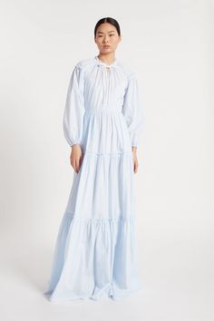 Long pale blue and white fine stripe cotton dress with built in slip. Ruffled tie neck, ruffled sleeve detail with elastic cuff, open back and tiered. Gathered skirt. Light Blue Ruffled Maxi Dress For Daywear, Duchess Satin, Silk Taffeta, Couture Details, Gathered Skirt, Funnel Neck, Circle Skirt, Pale Blue, Sleeve Detail