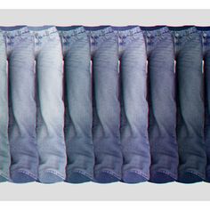 five pairs of jeans lined up in a row