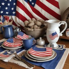 a patriotic table setting with american flags on it