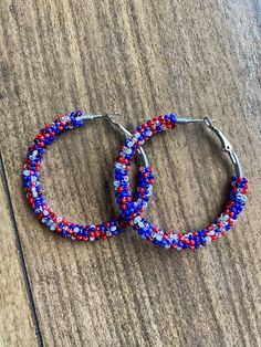 A pair of hoop earrings made with limited edition seed beads in unique matte, opaque and metallic red, white and blue! Comes in 3 sizes! 30mm (1 inch) 40mm (1.5 inch) 50mm (2 inch) These are made from a VERY limited mix so get them while you can! These one of a kind earrings are fantastic for raves, night clubs, parties, summer vacations, festivals or just for a pop of color in your wardrobe.  Made with a spring clasp for ease. Hypoallergenic professional grade metals, none of the cheap stuff us Cheap Stuff, Boho Hoop Earrings, Night Clubs, Summer Vacations, Jewelry Earrings Hoops, Red White And Blue, Limited Editions, Night Club, Seed Beads