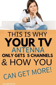 a woman sitting on top of a couch holding a remote in her hand and the words, this is why your tv antenna only gets 5 channels & how you can get more