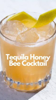 the tequila honey bee cocktail is served in a glass