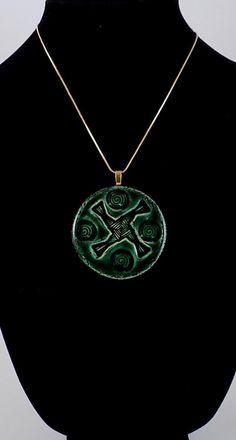 St. Brigid"s Cross pendant necklace in forest green glaze  and painted in gold on the back Measures between 2 1/4 inch  One pictured is the one for sale. Alternative Titles: Saint Bride of Ireland, Saint Bridget of Ireland, Saint Brigid of Kildare, Saint Brigit of Ireland St. Brigid of Ireland, Brigid also spelled Brigit or Bridget, also called Brigid of Kildare or Bride, Irish Bríd, (born, according to tradition, Fochart, near Dundalk, County Louth, Ireland--died c. 525, Kildare, Ireland; feast Green Necklace With Large Medallion Pendant, Green Symbolic Pendant Necklace, Collectible Green Amulet Necklace, Green Amulet Necklace Collectible, St Bridget Of Ireland, Saint Brigid Of Kildare, Louth Ireland, Brigid Cross, Saint Brigid