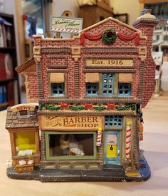 a small toy store on top of a wooden table