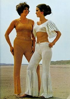 two women standing next to each other wearing matching outfits