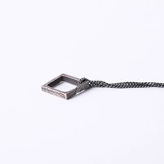 Square Pendant Necklace The square can represent basics, structure, and balance. The square will symbolize community, integrity, direction, and being practical and elemental. Wear this necklace as an amulet for order and stability in your life. This square pendant is a rustic piece of design made of 100% sterling silver. Size and Fit: The pendant's size: 16 mm x 17 mm You can choose to purchase only the pendant or add an oxidized sterling silver chain to it. The Details This necklace is made in Square Pendant Jewelry With Box Chain, Square Pendant Necklace With Adjustable Chain, Minimalist Silver Chain Necklace With Square Pendant, Sterling Silver Amulet Necklace With Square Pendant, Square Pendant Necklace, Mens Sterling Silver Necklace, Georgetown Tx, Mens Necklace, Square Pendant