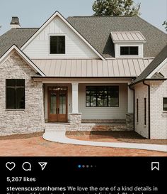 a white brick house with black windows and brown shutters on the front door is featured in an instagram