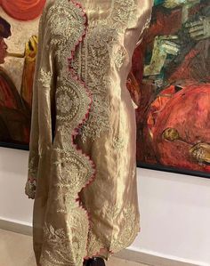 Item Overview ATHARVA Hand Woven Pure Tissue Silk Salwar Kameez/Aari Dori Embroidery/Gold Tissue/Heirloom Worthy/Custom Stitch Unstitch/Wedding/Plazzo/Gift/ Designer Wear Dno. SK2007 Fabric:  * Shirt: Pure Tissue Silk - Hand Embroidery/ 2.5 Mts Beautiful Aari Dori Work * Dupatta: Pure Tissue Silk - Hand Embroidery/ 2.5 Mts Beautiful Aari Dori Work/Elegant/Tassels/ * Bottom: Pure Tissue Silk 2.5 Mts. Excusive Hand Embroidered Party Wear Punjabi Suit. Customization: * Fabrics Customization: Designs Can be made in different Fabrics. *Color Customization: Designs Can be made in different Colors *Stitching Customization: 1. Salwar Kameez  2. Patiala Salwar Kameez  3. Churridar  4. Tunic Pants  5. Anarkali (Extra Charge) 6. Maxie (Extra Charge) 7. Plazzo Pants 8. Embroidered Pants or Salwars 9. Luxury Katan Silk Salwar Kameez With Dori Work, Semi-stitched Raw Silk Kurta With Dabka Work, Semi-stitched Chikankari Kurta For Reception, Semi-stitched Straight Kurta Churidar For Reception, Resham Embroidered Dola Silk Kurta For Reception, Dola Silk Kurta With Resham Embroidery For Reception, Semi-stitched Gold Chanderi Lawn Suit, Semi-stitched Resham Embroidery Churidar For Reception, Reception Resham Embroidery Straight Kurta Churidar