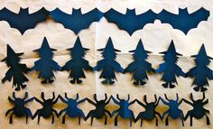 the silhouettes of bats are made out of paper and cut to look like people