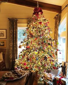 a decorated christmas tree in a living room