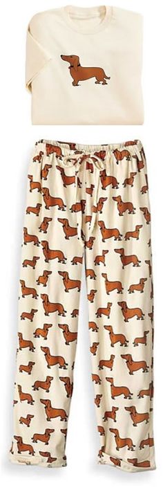 an animal print pajama pants with brown and white horses on it, in front of a white background