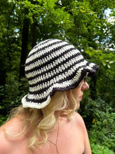 Lightweight acrylic spiral, striped hat, perfect for festivals, summer & transition. Super fun, stand out with this hat! Hand crocheted by Abi, made with love. Available in other colours on request. Check out my shop for more. ACRYLIC BUCKET HAT - Material: 100% Repurposed Acrylic - Quality and Sustainability: Handmade ∙ Slow Fashion SIZING - One Size, each product is unique so might vary slightly in size. Measures are based on the average size 22 inch circumference. CARE INSTRUCTIONS - Hand Wash Cold Dry Flat. Do not Tumble Dry or machine wash PROCESSING & DISPATCHING - We aim to ship all orders either the same day or the next working day. - Our standard shipping is with La Poste RETURNS - Please get in contact with me within 14 days of purchasing your item if you are unhappy and would li Black And White Crochet Hat, Black And White Crochet, Summer Transition, Bob Chapeau, Striped Hat, Handmade Hat, Crochet Handmade, White Crochet, Hand Crochet