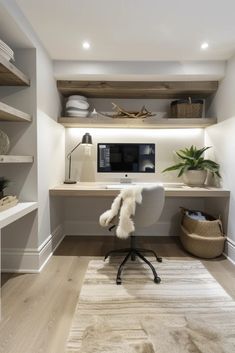 a home office with white walls and shelving in the corner, along with an area rug on the floor