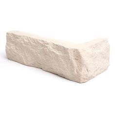 a large white rock sitting on top of a white surface