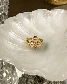 The Clover Ring will bring you luck, original French suit for centuries: clubs. Perfect for a casino look for the clubs card symbol. This ring is made with half pearl shell and cubic zirconia. 18kt gold plated silver. Clubs Card, Clover Ring, Club Card, Pearl Shell, Gold Plated Silver, Casino, Cubic Zirconia, Shells, Gold Plate