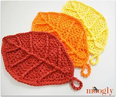 three crocheted hats sitting next to each other