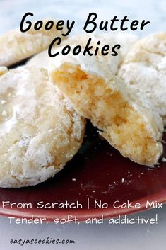 some cookies are on a red plate with the words gooey butter cookies above it